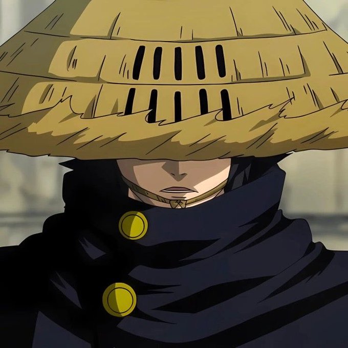 An animated character wearing a large woven straw hat that obscures their eyes, dressed in a dark cloak with gold buttons and a bamboo muzzle.