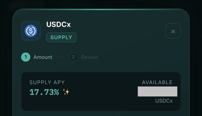 The image features a screen displaying options related to USDCx supply, featuring two options: one available at 17.73% APY (available as collateral), and another option that is auto-compounded at 22.09%. The main focus of this image seems to be related to the use of funds on USDCx in exchange for tokens, as it's a visual representation of what might appear like an app, which shows two options available for USDCx supply.