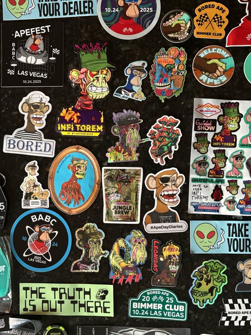 The image features a black background with various stickers, including some that say "bamy", "infinity", and "boring". These stickers are arranged in a way that they cover most of the wall space behind them. The text on these stickers seems to be related to a specific event or gathering, possibly an event at the BIMber Club.

The post also mentions that there is a "BAYC" sticker present in the image. This could potentially be a reference to a particular event or location associated with the BIMber Club. The presence of this sticker suggests that the image might have been taken during one such gathering, where attendees used stickers as a means of communication and identification within the club.