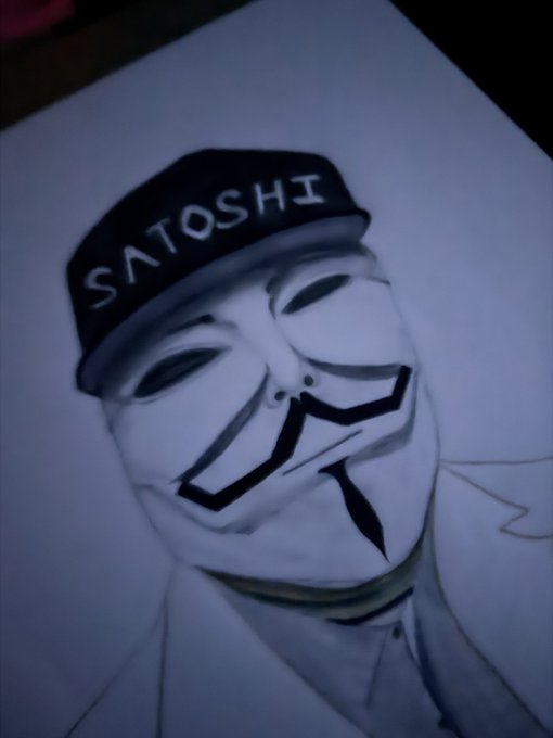 A drawing of the Guy Fawkes 'V for Vendetta' mask wearing a black cap with 'SATOSHI' written on it.