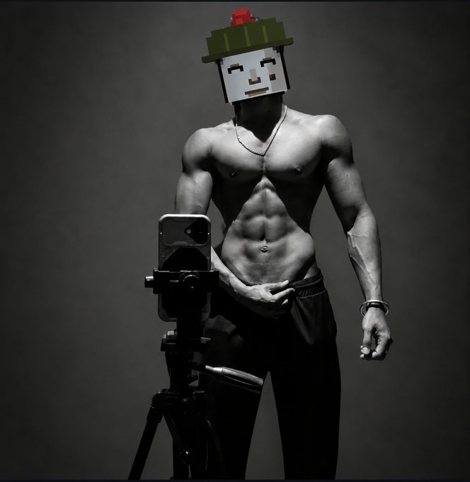 A black and white photograph of a shirtless, muscular man taking a mirror selfie with a camera on a tripod; his face is obscured by a pixelated blocky head graphic with a red rose on top.