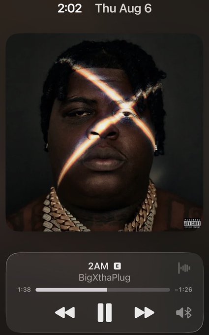 A music player screen shows the song "2AM" by BigXthaPlug with album art featuring a man with an X across his eyes and a Parental Advisory label.