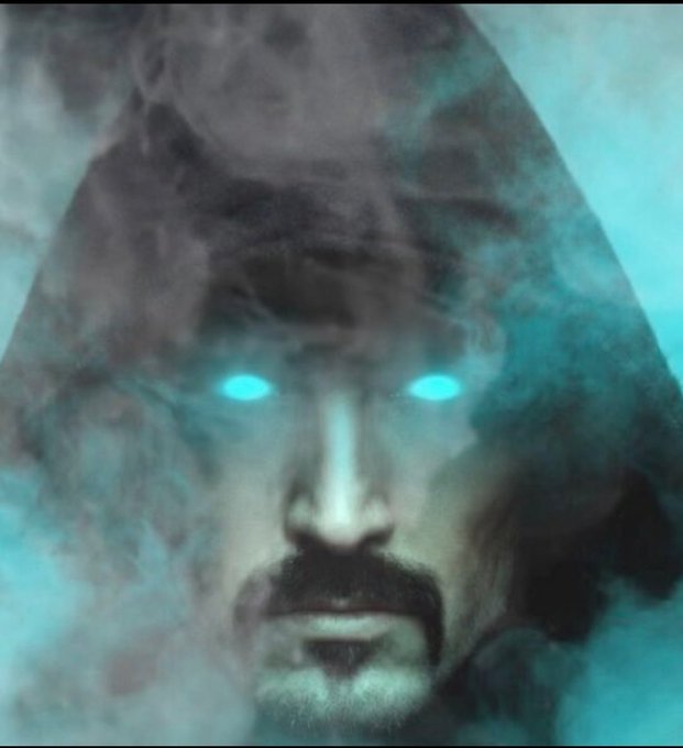 The image features a man with blue eyes wearing a hooded robe or cape, giving him an eerie appearance as he looks directly at the camera. The background of the image is filled with smoke, which further enhances the mysterious atmosphere surrounding the man's face. The caption below the image reads "ShadowFog.io is your go-to resource for ensuring safe investments in the Solana token ecosystem". This suggests that the image might be related to a promotional or educational piece about investing in cryptocurrencies like Bitcoin and Ethereum.