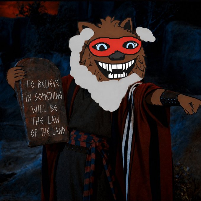 A cartoon werewolf in a red mask and robe holds a stone tablet reading 'TO BELIEVE IN SOMETHING WILL BE THE LAW OF THE LAND'.