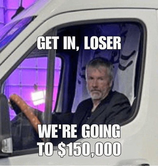A meme featuring a serious-looking older man with a beard sitting in the driver's seat of a white van, with text overlay reading "GET IN, LOSER" at the top and "WE'RE GOING TO $150,000" at the bottom, referencing the classic "Mean Girls" quote while suggesting a bullish price target.