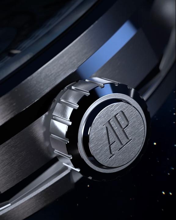 Close-up of an Audemars Piguet (AP) watch crown with a starry night dial visible in the background.