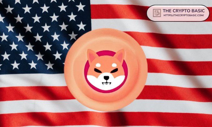 The image shows a Shiba Inu coin (featuring the iconic dog logo) overlaid on an American flag background, with "The Crypto Basic" watermark and URL "https://thecryptobasic.com/" in the top right corner. The visual ties into the post's news about cryptocurrency exchange UEX.US listing Shiba Inu (SHIB), with the American flag symbolizing the U.S.-based exchange and the SHIB coin representing the newly listed meme coin.