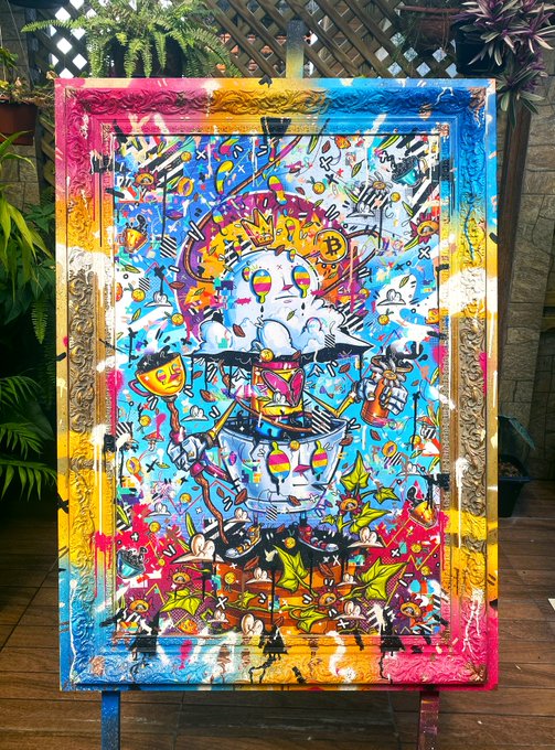 A vibrant, colorful painting featuring cartoonish designs, a Bitcoin symbol, and graffiti-style art on a large canvas with an ornate frame.