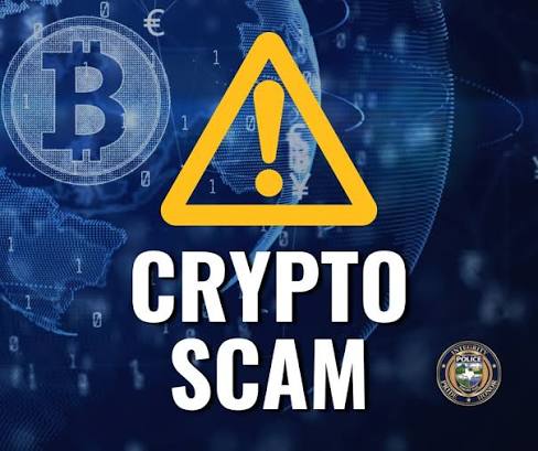 A warning graphic featuring a yellow triangle with an exclamation mark, the text 'CRYPTO SCAM', a Bitcoin symbol, and a digital globe background.