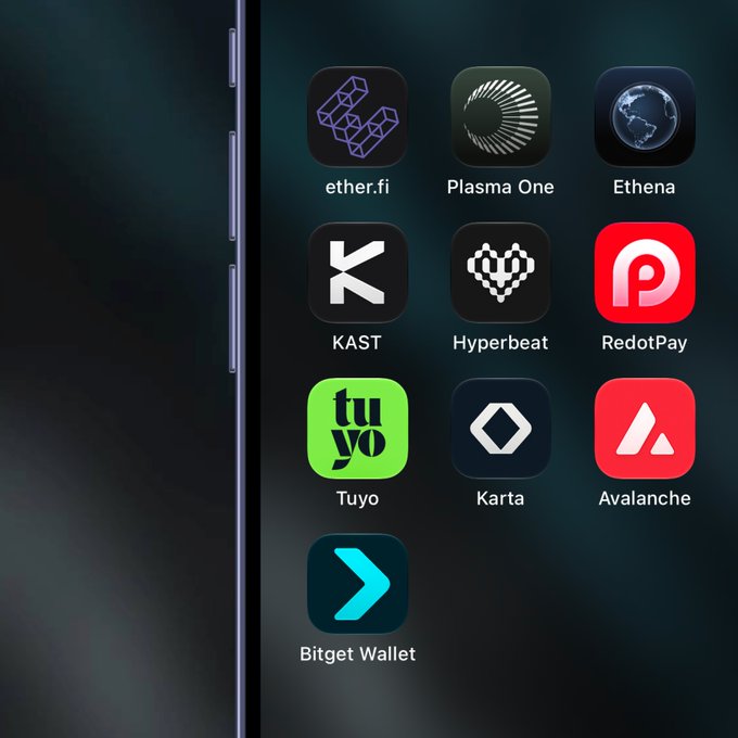 A smartphone home screen displays various crypto and fintech app icons including "ether.fi", "Plasma One", "Ethena", "KAST", "Hyperbeat", "RedotPay", "Tuyo", "Karta", "Avalanche", and "Bitget Wallet".