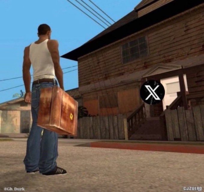 A video game screenshot showing a man in a white tank top and jeans holding a brown suitcase, standing on a sidewalk near a wooden house, with "@Gh_Durk" and "CJZUEFO" visible as watermarks and a black circle with a white 'X' icon.