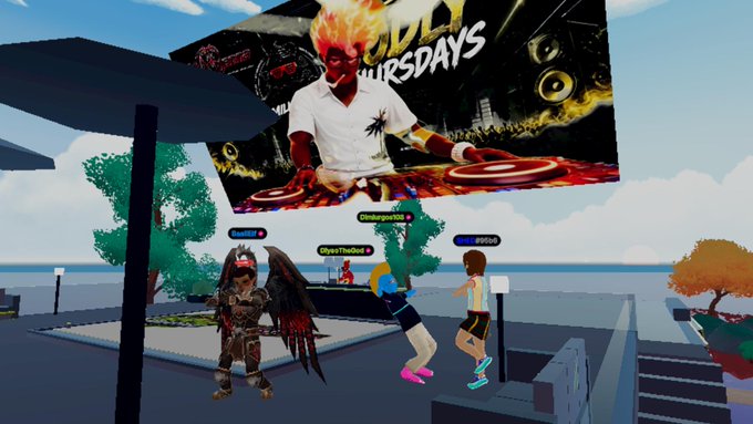 A VR/virtual world scene showing avatar characters in front of a large billboard featuring a fiery-haired DJ with 'THURSDAYS' text, in an outdoor environment.