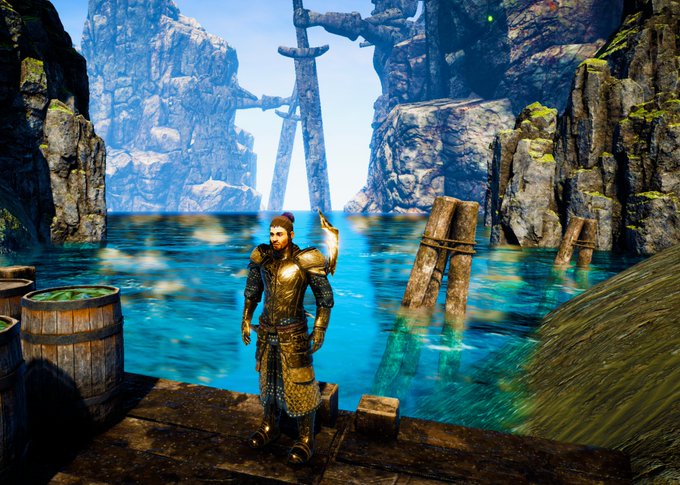 A bearded warrior in dark metal armor stands on a wooden dock, gazing out at a serene blue waterway surrounded by towering rocky cliffs and weathered wooden pilings, evoking a sense of awaiting a grand adventure. The caption accompanies a post about "$HermesWorld v2" nearing completion, with the character poised at the threshold—much like a hero ready to pass through the opening gates of a new virtual realm.