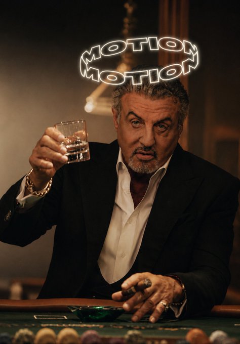 A photo of Sylvester Stallone in a suit raising a glass, with a neon sign reading 'MOTION MOTION' above him and a cigar in his other hand.