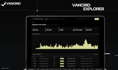 A laptop displaying the VANGRID EXPLORER dashboard with network metrics including block height, transactions, and USD value.