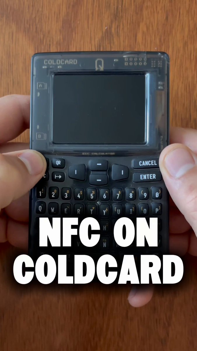 The image shows a person holding a small black device with a keyboard on top of it. The text "NFRC ON COLDRARD" is displayed above the device, indicating that the device is designed for use with the NFRC (National Financial Crimes Commission) and Coldcard payment systems.