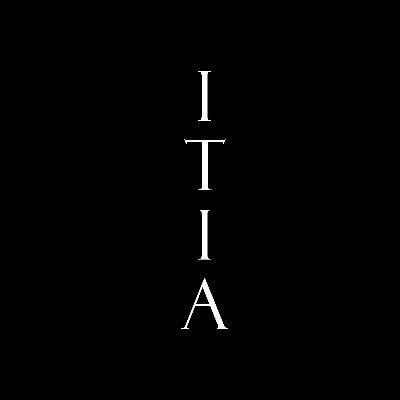 A black image with the word 'ITIA' spelled vertically in white serif letters.