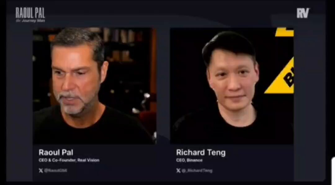 The image shows two men's faces, one of whom has their face displayed on a screen along with text that reads "X. RAVOUAL. P." The other man appears to be a guest speaker or an expert on the topic being discussed in the image.