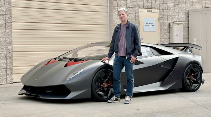 A man stands next to a matte gray Lamborghini with red accents, parked in front of a building marked "Suite E" with a sign reading "Par Avion 480-614-8444." The luxury sports car likely symbolizes the wealth or financial success that the post implies could be achieved (or lost) by trusting Ripple ($XRP).
