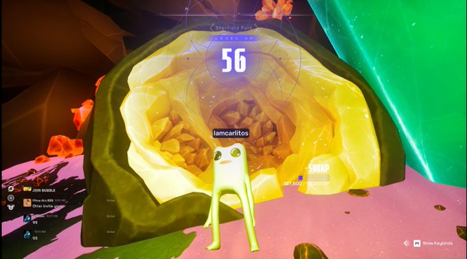 A screenshot from a video game showing a small green alien-like character standing in front of a glowing yellow rock formation, with a HUD displaying the number '56' and the username 'lamcarititos'.