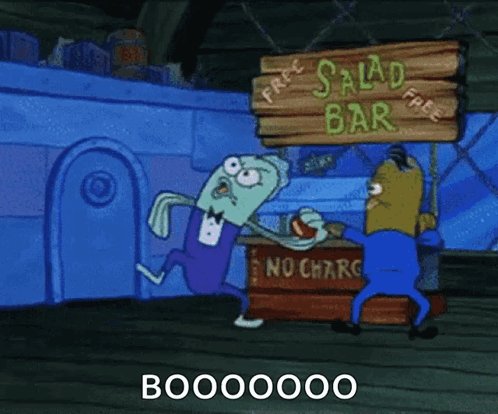 The image features a cartoon scene with two characters, one wearing a blue suit and the other dressed as a fish. They are standing next to each other near a salad bar sign that reads "Free Salad Bar". The cartoon character in the blue suit is holding up a sign that says "BOOM! BOO! BOO! BOO! BOO!".