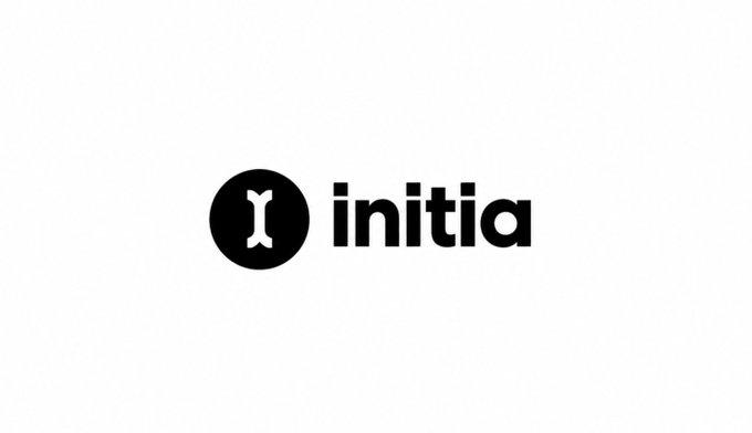 The black Initia logo on a white background, featuring a circular icon with a white branch-like symbol beside the word “initia.”