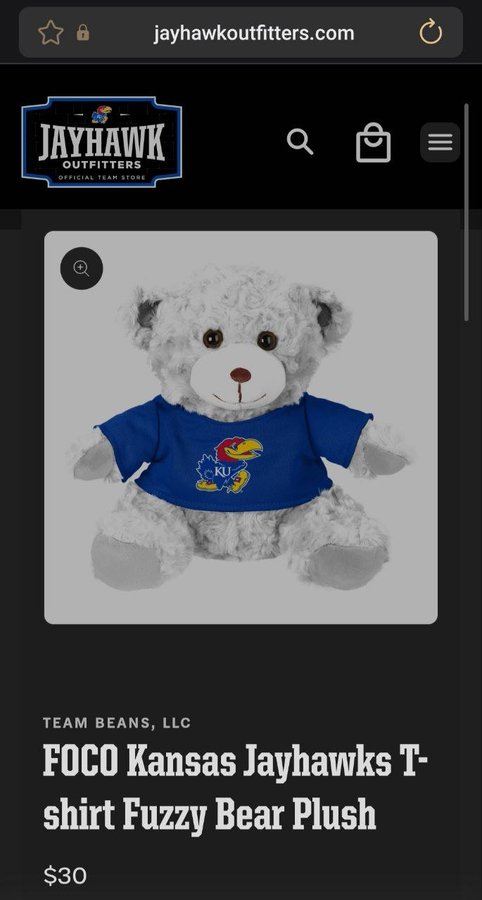 A mobile screenshot from jayhawkoutfitters.com showing a 'FOCO Kansas Jayhawks T-shirt Fuzzy Bear Plush' priced at $30, sold by Team Beans, LLC.