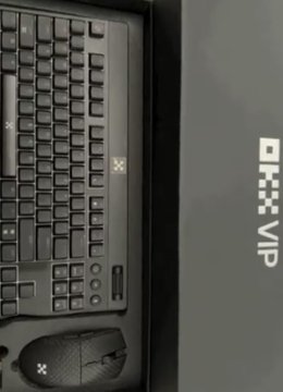 A close-up of a black computer keyboard and mouse next to a black mousepad with 'BHX VIP' text.