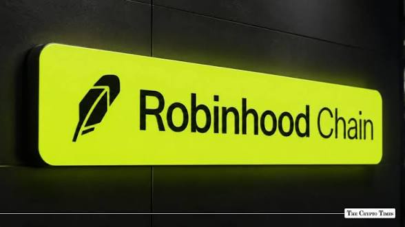 A glowing yellow-green illuminated sign displays the "Robinhood Chain" logo featuring a quill emblem, mounted on a dark wall. The image highlights Robinhood's blockchain infrastructure, which quickly expanded into a major crypto ecosystem spanning tokenized stocks, stablecoins, memecoins, perpetuals, and lending since its launch.