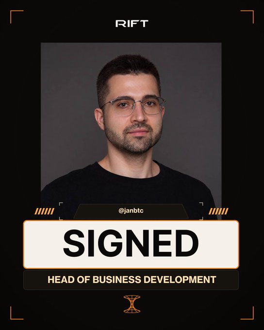 A professional 'RIFT' team announcement card featuring a headshot of a man with glasses and a beard, announcing him as '@janbtc' who has been 'SIGNED' as 'HEAD OF BUSINESS DEVELOPMENT'.