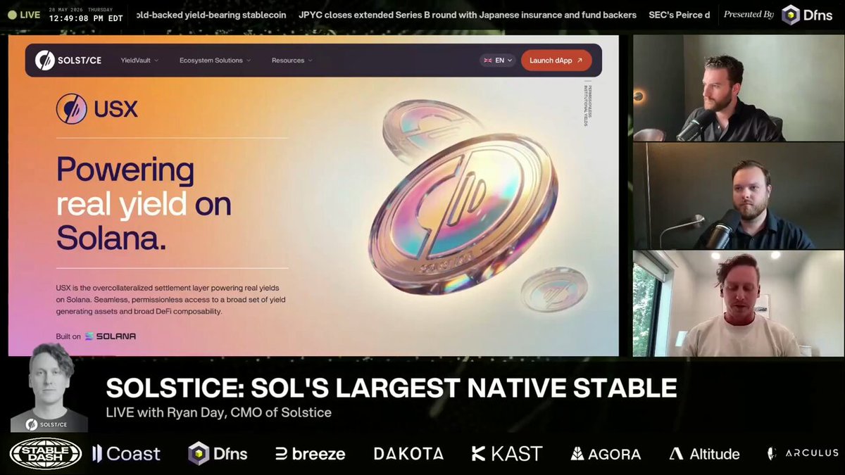 The image shows a screen displaying a website called "solsticefi CMO @ RyanDay" with a logo for Solana. The website has a banner at the top that says "USX is our stablecoin. That's how you get into the ecosystem, the settlement layer." There are three men in the image, one on each side of the screen, and they appear to be discussing something related to the website or its content.