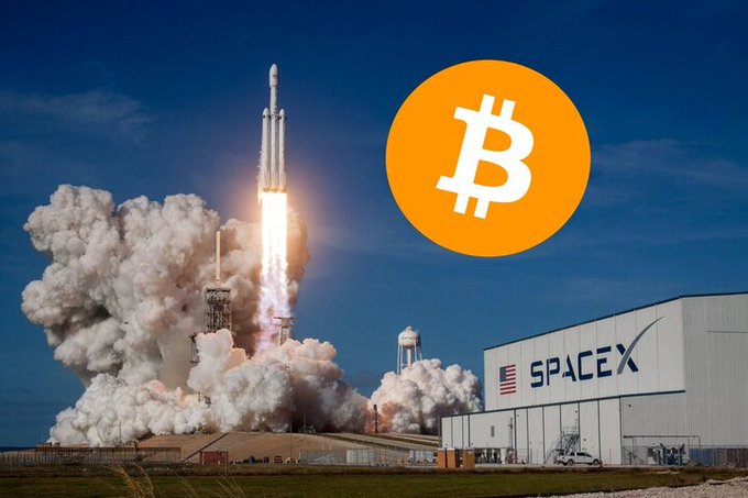 The image features a rocket launch from the Spacex facility, with the Bitcoin logo floating above it. The caption below the image reads "JUST IN: Elon Musk'S SpaceX officially becomes 8th largest public Bitcoin holder with 18,712 BTC". This suggests that the Spacex facility is now holding Bitcoin as its largest cryptocurrency holder, and the Bitcoin logo is displayed prominently in the image to emphasize this achievement.

The rocket launch itself is a powerful visual representation of progress and innovation, while the Bitcoin logo symbolizes the integration of technology into various aspects of our lives. The combination of these elements creates an interesting juxtaposition between space exploration and digital currency, highlighting the rapid advancements in both fields.