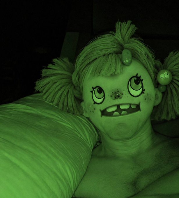 A nighttime selfie with face paint depicting a cartoonish green monster girl with pigtails, freckles, and fangs, matching the eerie, sleep-themed "Soon" caption. The dark, green-tinted lighting enhances the spooky, dreamlike mood of the costume.