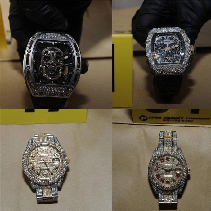 A collage of four luxury watches covered in diamonds, including a Richard Mille skull watch, with a card reading "LYNN GRAVRY COMPANY 800-255-6486".