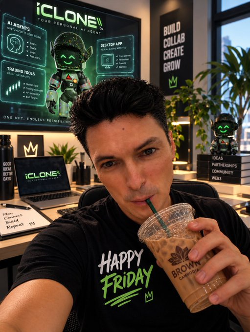 A man wearing a 'HAPPY FRIDAY' t-shirt drinks an iced coffee from a Brown Cambodja cup in an office featuring 'iClone' branding, AI agent posters, and motivational signs like 'BUILD COLLAB CREATE GROW'.