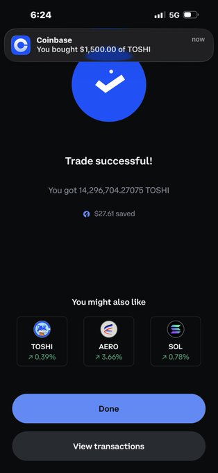 A Coinbase mobile app screenshot confirming a successful trade, with a notification reading 'You bought $1,500.00 of TOSHI' and a message stating 'You got 14,296,704.27075 TOSHI' along with a '$27.61 saved' indicator.