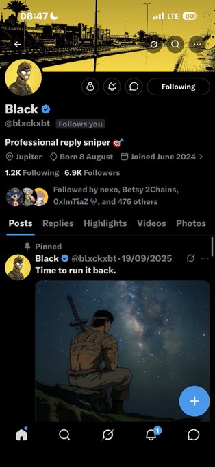 The image shows a social media app with a black background, featuring a post from a user named "Black" who has posted a picture of themselves sitting on top of a cliff or mountain. The post includes a caption that reads "First win Echo? Thank you brother BakyXRTtW2cdivHrqoENQhSfaMjGLRgDudV8QSBGcKNf". This post has been shared by multiple people, and the user's name is also visible in the image. The app displays a list of followers who have liked or commented on this post, as well as a "Following" button that allows users to follow the account.