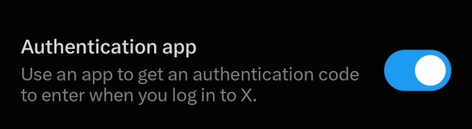 A settings toggle screen for 'Authentication app' on the X platform, with text 'Use an app to get an authentication code to enter when you log in to X' and the toggle switched on.