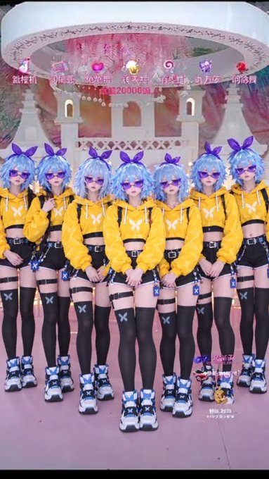 Six identical anime-style figures with blue hair, bunny ear accessories, yellow hoodies, black shorts, and black thigh-high stockings stand in a row, with Chinese text visible at the top.