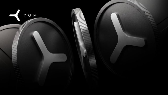 A sleek, dark 3D-rendered image of circular devices with Y-shaped designs, branded with the YOM logo in the upper left corner.