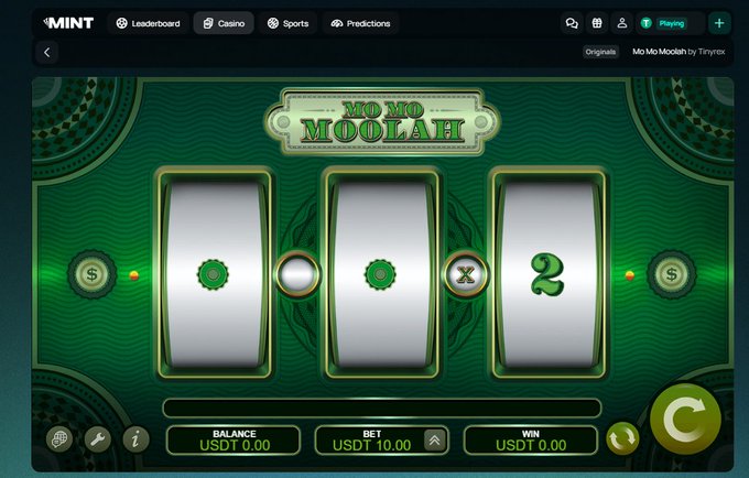 A screenshot of an online slot machine game called 'Mo Mo Moolah' with three reels, showing a balance of USDT 0.00, a bet of USDT 10.00, and a win of USDT 0.00.