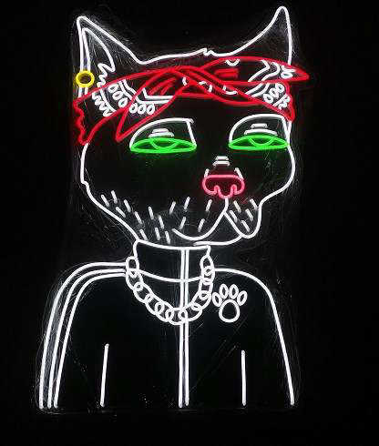A neon light design depicting a stylized cat character with green glowing eyes, a pink nose, a chain necklace with a paw print charm, and a red bandana with white text.