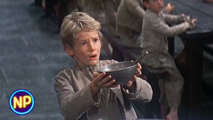 A young, blonde-haired boy in tattered clothing holds up an empty bowl with a pleading expression, his face conveying desperate hope. A "NP" logo is visible in the bottom left corner. The image humorously illustrates the poster's plea for crypto market volatility, with the boy symbolizing the hopeful investor waiting for market action to fill his "bowl."