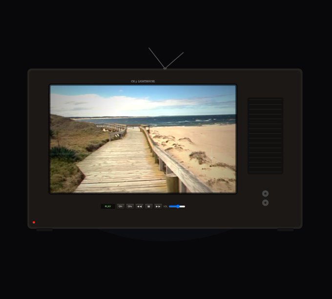 A dark gray retro-style television set with rabbit-ear antennas displays a scenic view of a wooden boardwalk leading to a sandy beach under a blue sky.