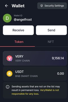 A mobile screenshot of the "Wallet" section of the Verychat app shows a user account (@angelfrost) holding 9,156.14 VERY tokens and 0.00 USDT, with a warning about permanent loss for unlisted assets. The image supports the post's theme by visually displaying VeryChat's cryptocurrency wallet, emphasizing the need to actively participate (e.g., mining or engaging with the platform) before expecting rewards.