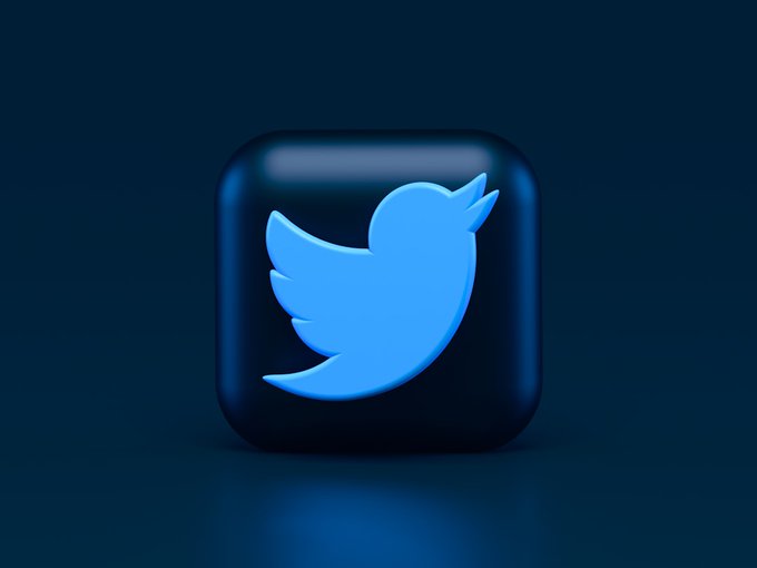 A 3D-rendered app icon featuring the light blue Twitter bird logo on a dark, glossy rounded square button against a dark blue gradient background.