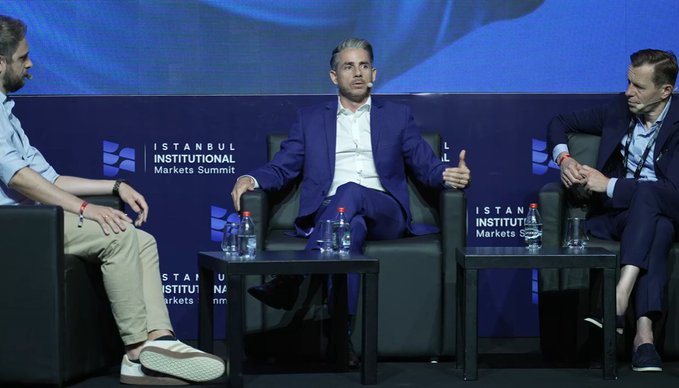 Panelists discuss institutional markets at the Istanbul Institutional Markets Summit, with visible branding for "ISTANBUL INSTITUTIONAL Markets Summit" behind them, featuring representatives from Ripple, Coinbase, and Amina Bank seated on stage with water bottles in front. The accompanying post highlights that despite the under-the-radar nature of such recordings (fewer than 60 views), the discussion captured valuable insights from Ripple's MD Reece Merrick alongside Coinbase and Amina Bank representatives.