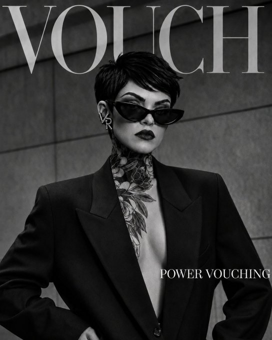 Black-and-white magazine-style poster with large 'VOUCH' text and 'POWER VOUCHING' tagline, featuring a person in a black blazer with floral neck tattoos wearing cat-eye sunglasses.