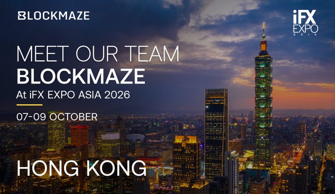 A promotional graphic for Blockmaze announcing their attendance at iFX EXPO Asia 2026 in Hong Kong from 07–09 October, set against a vibrant sunset cityscape featuring the iconic Taipei 101 tower. The image's text—"MEET OUR TEAM BLOCKMAZE," event dates, and location—directly supports the post's announcement of the team's participation at the expo.