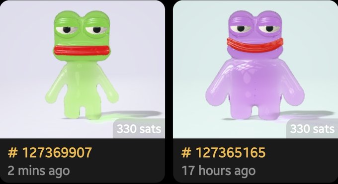 Two 3D-rendered frog-like figurines with half-closed eyes are displayed for sale at 330 sats each, with listing numbers #127369907 and #127365165.